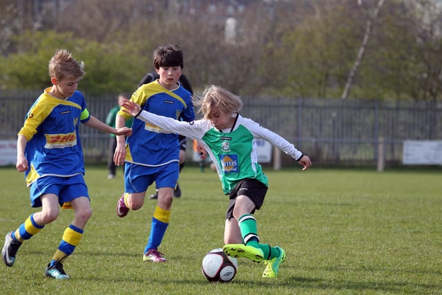 Action from NTFA All Weather Cup under 11 between Grange Park Rangers and Towcester Town at Studland Road
