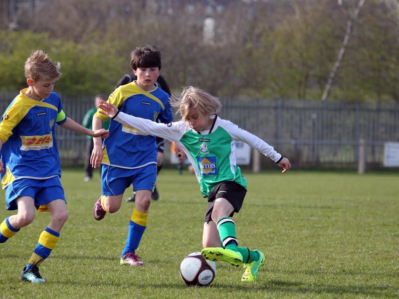 Action from NTFA All Weather Cup under 11 between Grange Park Rangers and Towcester Town at Studland Road