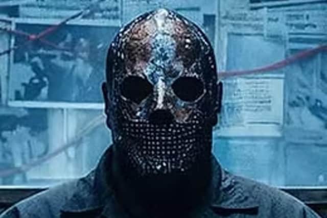 The audience of Sins is led by a mysterious figure called The Examiner