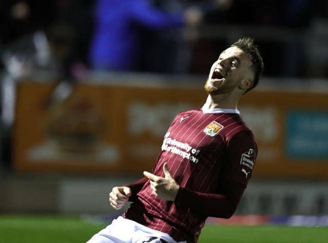 Marc Leonard celebrates Mitch Pinnock's third goal against Reading, which all-but wrapped up victory for the Cobblers.