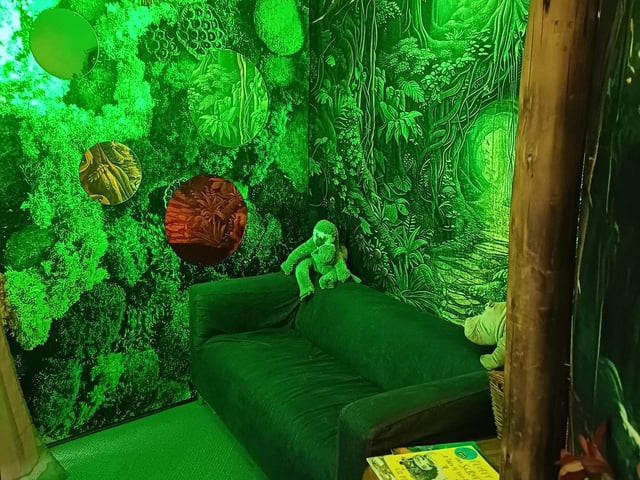 A dark jungle themed area supports regulation.