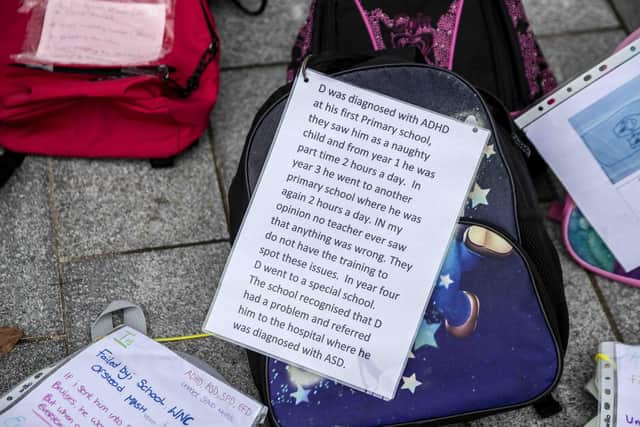 Each back pack represents a 'child 'failed' by WNC, the parents said