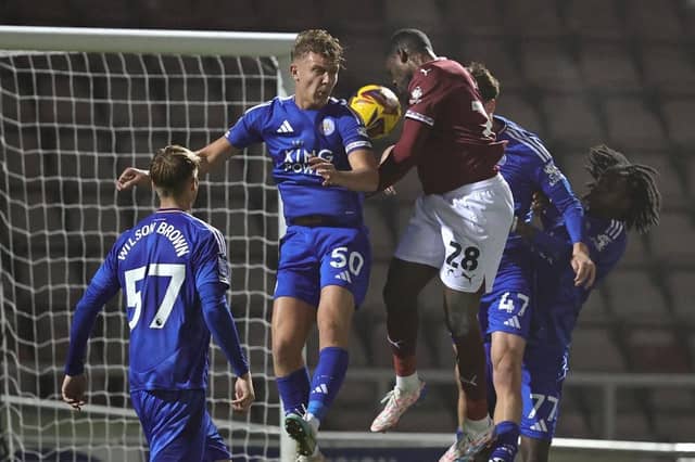 TJ Eyoma heads in the opening goal against Leicester Under-21s.