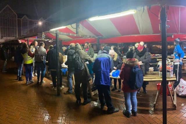The Monday Night Team, founded by Lisa Camody, set up on the Market Square and had prepared 54 Christmas dinners for those in need.