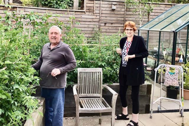Brackley Care Home residents Richard and Louise tending to the tomatoes