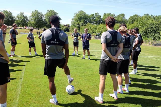 NORTHAMPTON, ENGLAND - JULY 02: Northampton Town manager Chris Hogg talks to his players during a Pre-Season Training session at Moulton Colllege on July 02, 2026 in Northampton, England. (Photo by Pete Norton/Getty Images)