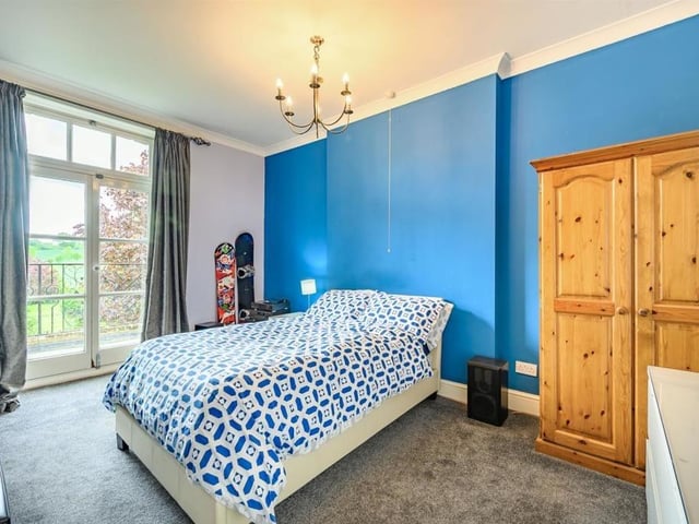 This Victorian home has a tennis court, huge gardens and a private mooring on the River Nene.
