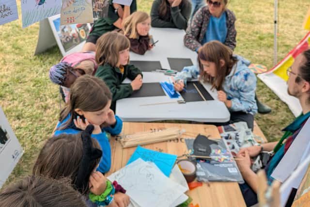 Young people taking part in a workshop at Camp 100