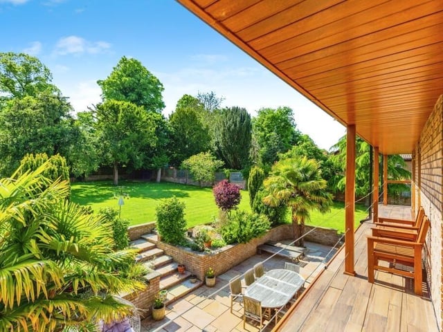 The rear of the property boasts a balcony on the first floor, with views overlooking the back garden
