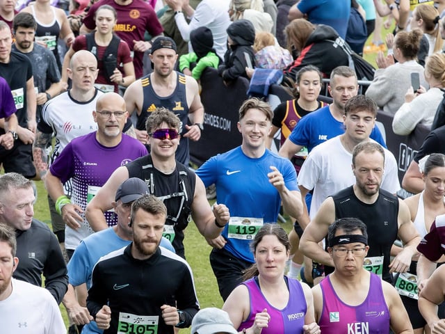 Hundreds of runners braved showers and wind to take on the race on Sunday (May 25), which started and finished at Sixfields stadium.