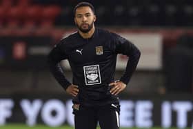 Liam Moore warms up with the Cobblers before Tuesday's game against Leyton Orient