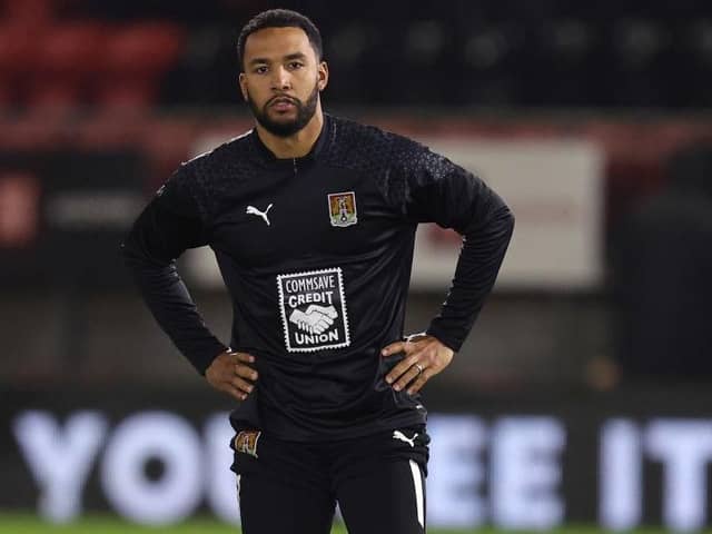 Liam Moore warms up with the Cobblers before Tuesday's game against Leyton Orient