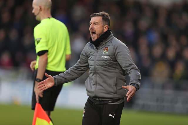 Jon Brady barks out instructions on the touchline during Saturday's League One match between Northampton and Oxford United