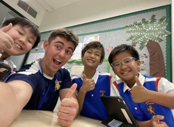 Thumbs up for Turing! Harry and some of his students in Thailand.