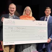 Cheque presented by Mark Conway (far right) to the theatre's Chris Smith and Jo Gordon