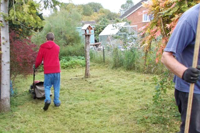 Garden Buddies volunteers assisting community members to maintain their garden