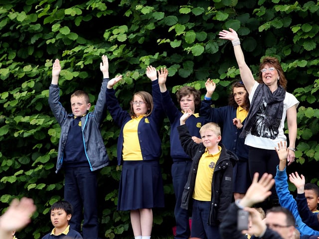 Crowds waving goodbye to Bob at his retirement party