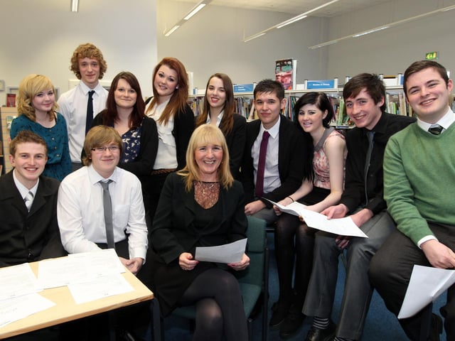 2012 - Kingsthorpe College Principal Judith Long with lower sixth pupils. The school has been congratulated by Nick Gibb for being in the top 100 school for sustained improvement in their GCSE results for the past three years.