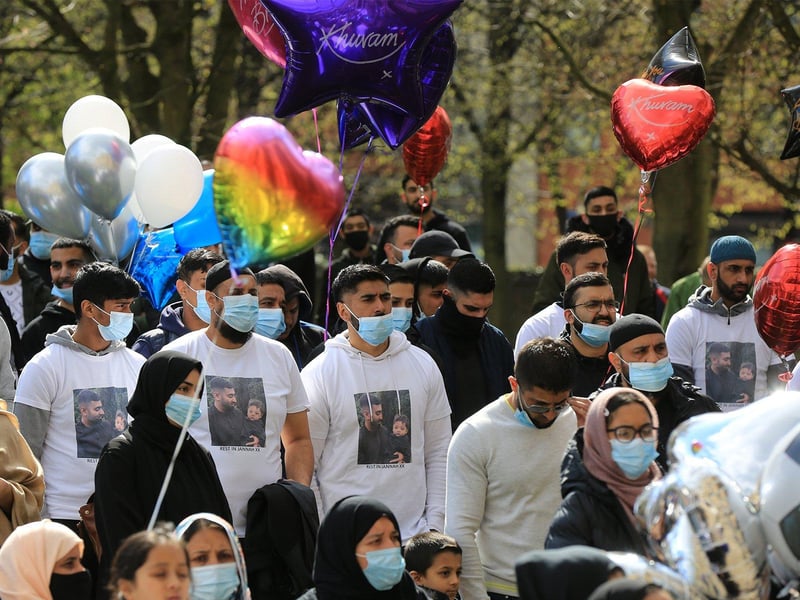 Many came dressed in t-shirts with a picture of Khurm and his son on them.