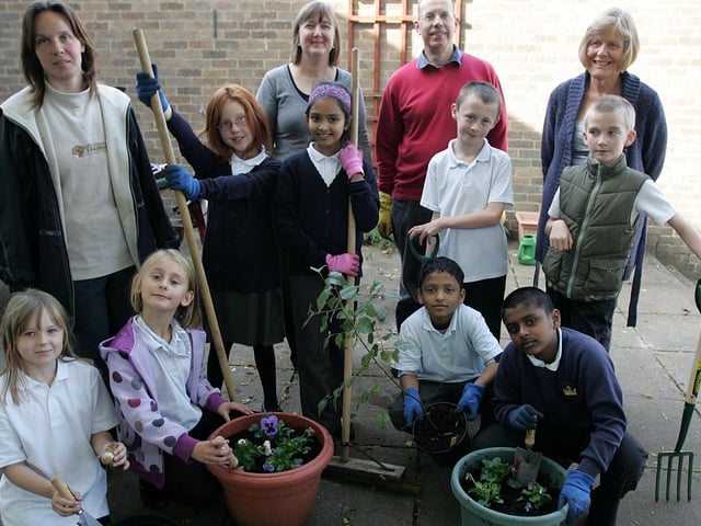 A gardening club set up by children, staff and parents at Kingsley Primary School. Pictured: Andrea Priestley, Beverley Cole, Alan March and Elizabeth March with members of the gardening club.