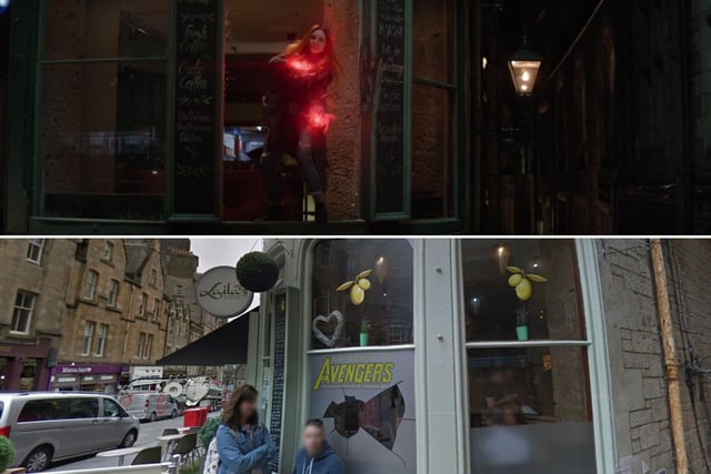 Wanda is blasted into a restaurant's front window after trying to save Vision from the two intruding aliens. Laila's lent into the brief glimpse of the restaurant we get in the film by putting a sticker on the window where Wanda went through. She's back up again quickly and stands in the smashed window frame to lift Vision away to our next filming location.