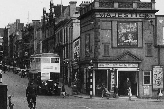 A retro bus travelling down Gold Street.