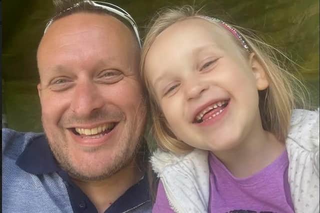 Darren Lee, with his daughter Ayla, says he struggles to find a spot despite paying the council for a permit