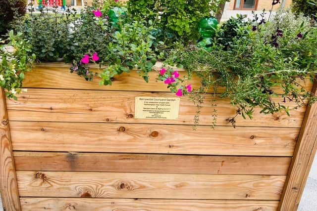 Flower baskets, made by patients and staff, at the spiritual garden