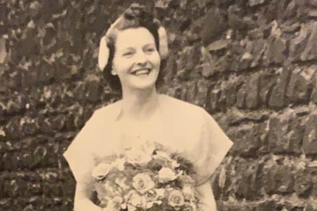 Annie on her and husband Jimmy's wedding day in 1952, in a pale mint green wedding dress.