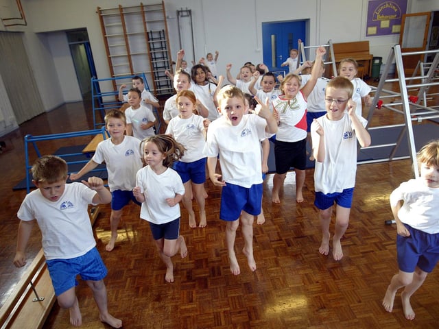 Sunnyside Primary School, Kingsthorpe, Northampton, children doing PE and warming up