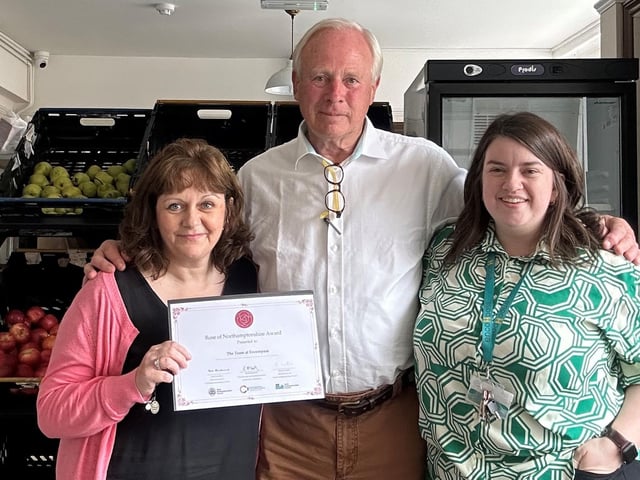 David Laing, Vice President of Northamptonshire Community Foundation, presenting the team at Encompass with their Rose of Northamptonshire Award. Encompass is a small local charity working with the homeless community and those suffering with addiction across North Northamptonshire. The team also operate food banks and plan to set up a café and day centre