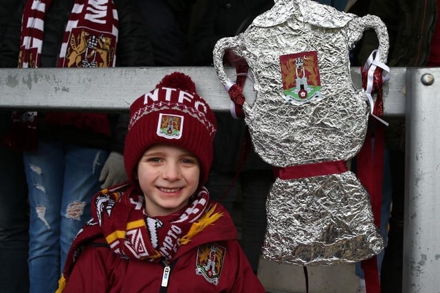 A young Northampton Town fan poses with his homemade tin foil FA Cup prior to the FA Cup Third Round match between Burton Albion and Northampton Town at Pirelli Stadium on January 05, 2020.