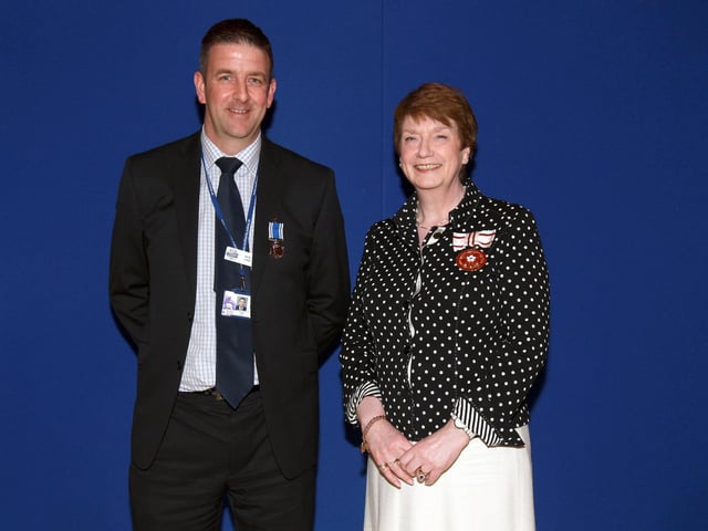 2013 - Northamptonshire Police Long Service awards ceremony takes place at their Headquarters, Wootton Hall, Northampton. Det Constable Pete Long, presented by Deirdre Newham.