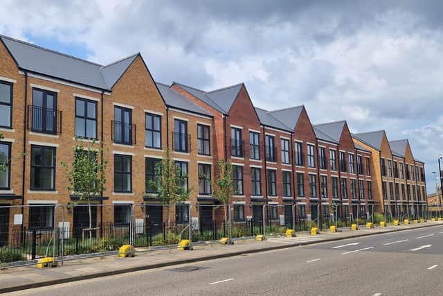 The completed Castle Street homes in Spring Boroughs remain fenced off and empty.