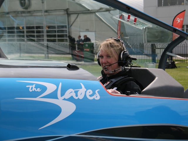 Chronicle & Echo reporter Liz Lee flies in a stunt plane by The Blades at Sywell in 2010.
