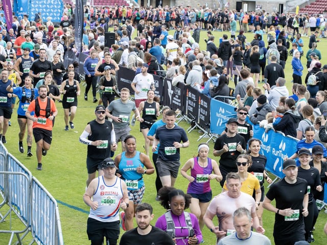Hundreds of runners braved showers and wind to take on the race on Sunday (May 25), which started and finished at Sixfields stadium.