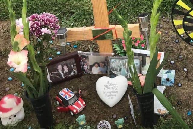 The grave of Michael Bishop in Kingsthorpe cemetery, where loved ones placed photos along with his Mini Cooper model (pictured).