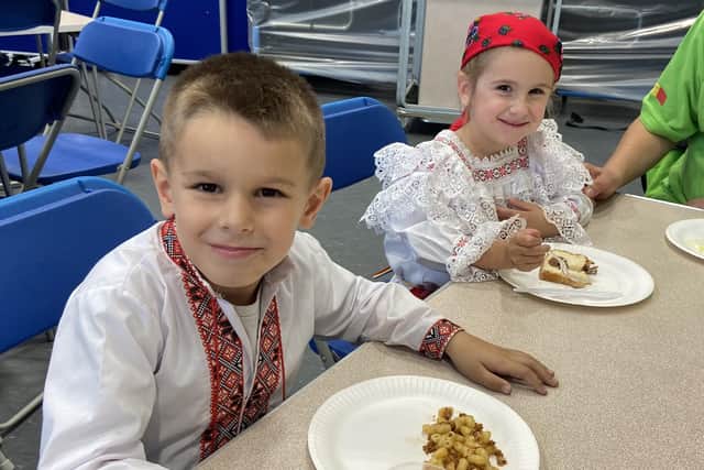 Pictured are year one (left) and reception (right) pupils in their traditional Romanian dress. The students were encouraged to wear outfits that reflected their culture.