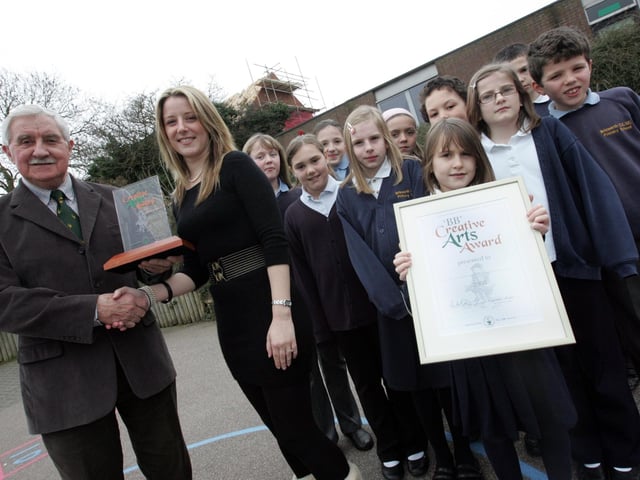 2009: Gordon Wright hands over a BB Creative Arts Award to the children at Brixworth Primary School.