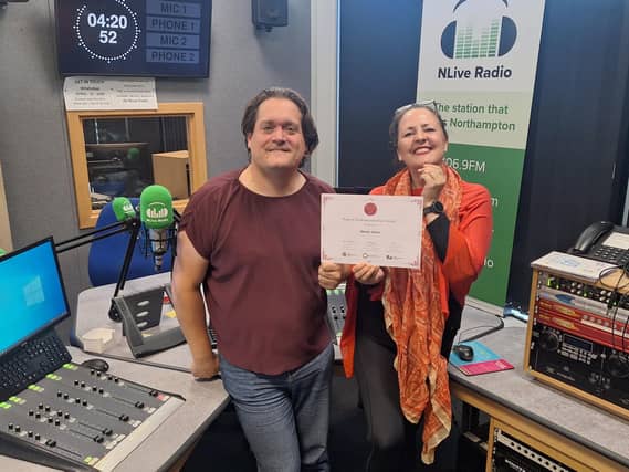 Martin Steers in studio being presented with certificate with Rachel McGrath CEO Northamptonshire Community Foundation