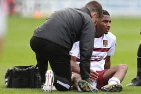 Akin Odimayo receives treatment from physio Michael Bolger.