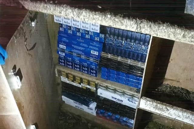 Hundreds of illegal tobacco products were found at the rear of the premises hidden in a chicken coop