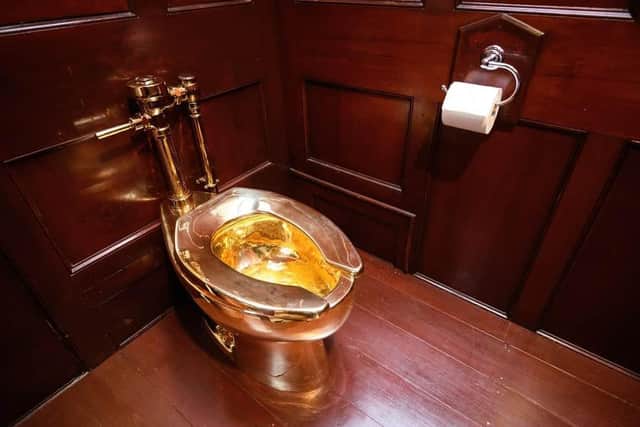 The fully functioning gold toilet, titled ‘America’, created by Italian artist Maurizio Cattelan and housed in Blenheim Palace/Thames Valley Police