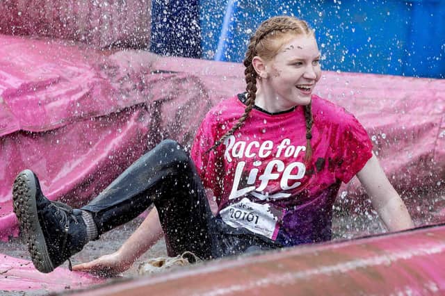 All smiles as participants tackled obstacles during Race for Life's Pretty Muddy on Saturday July 13, 2024 in Abington Park.