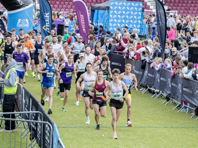 Hundreds of runners braved showers and wind to take on the race on Sunday (May 25), which started and finished at Sixfields stadium.