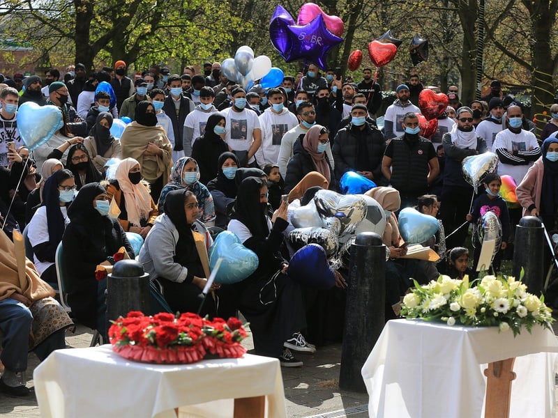 Mourners brought dozens of balloons to the service.