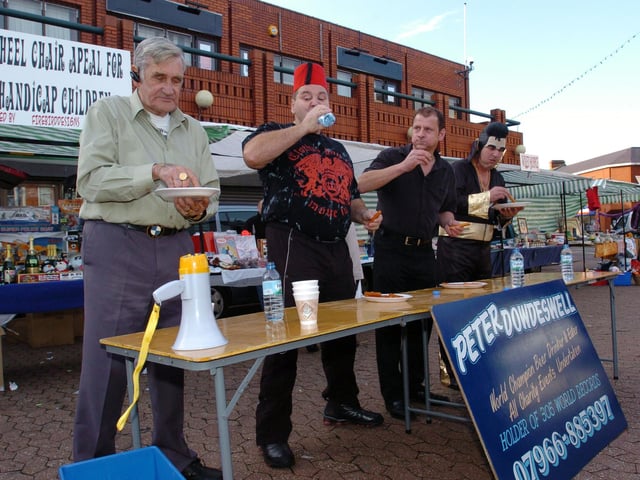 Hot Dog eating world record attempt at Agora Wolverton. Peter Dowdswell - (grey shirt), of Northampton, holds 305 world records for beer drinking and food eating. Raised £4 and a 1/2 million since 1964 for handicapped kids. Previous record was nine in one minute Peter ate 26! New World Record.