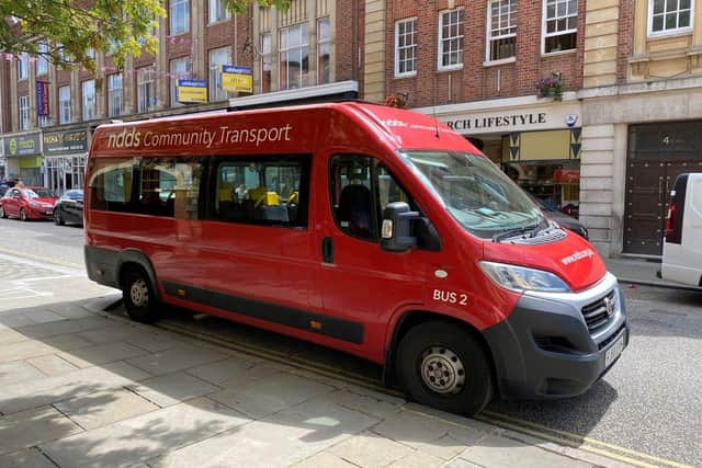 Their red minibuses provide essential transport for individuals who cannot access public transport, which may be as a result of impaired mobility or disability.