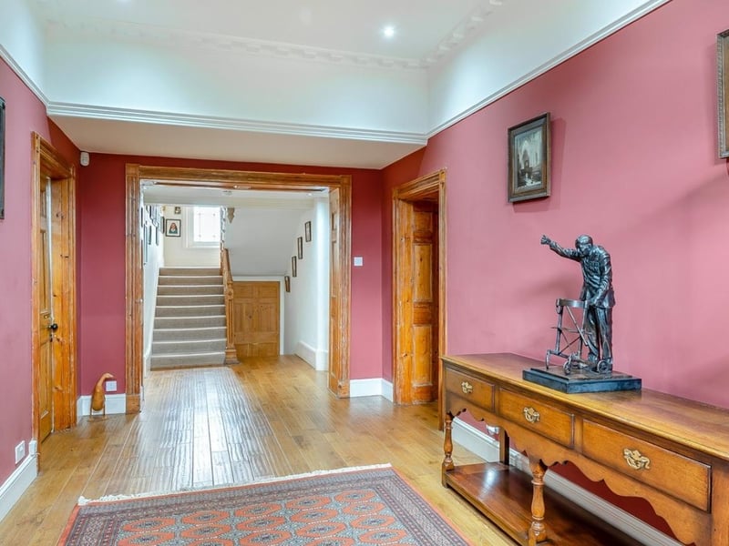 The hallway takes you into the main house, with a sitting room, snug and office to the left and right. Sadly, we don't think the statue will be staying...