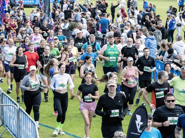 Hundreds of runners braved showers and wind to take on the race on Sunday (May 25), which started and finished at Sixfields stadium.